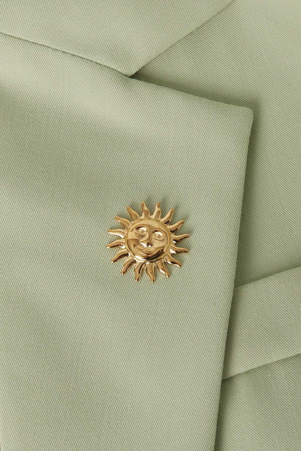 spilla sole