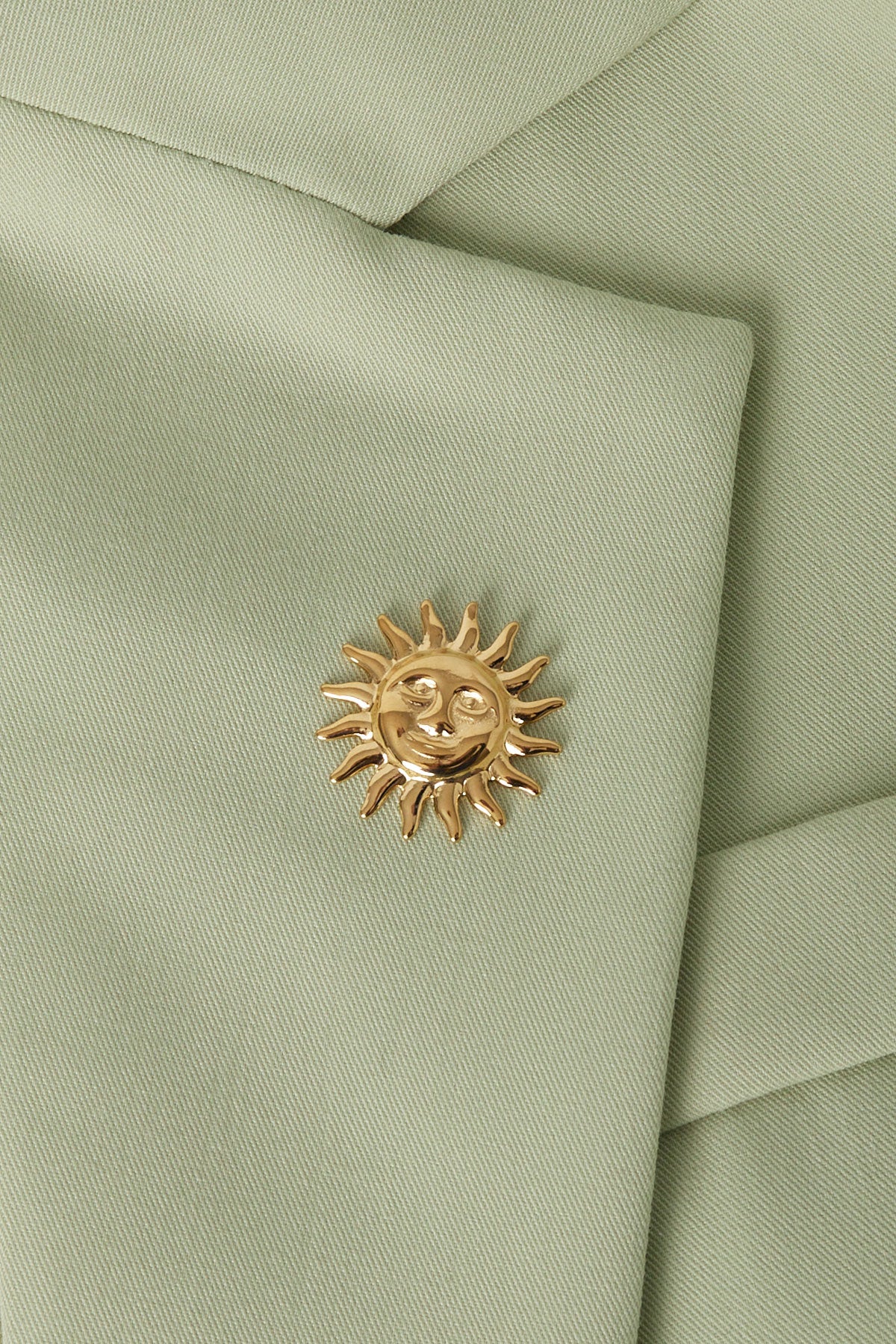 spilla sole