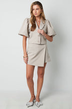 Gonna corta in poliestere da donna Design asimmetrico con sovrapposizione