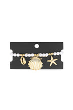 bracciale di perle con ciondoli marini