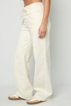 Jeans in denim con lacci