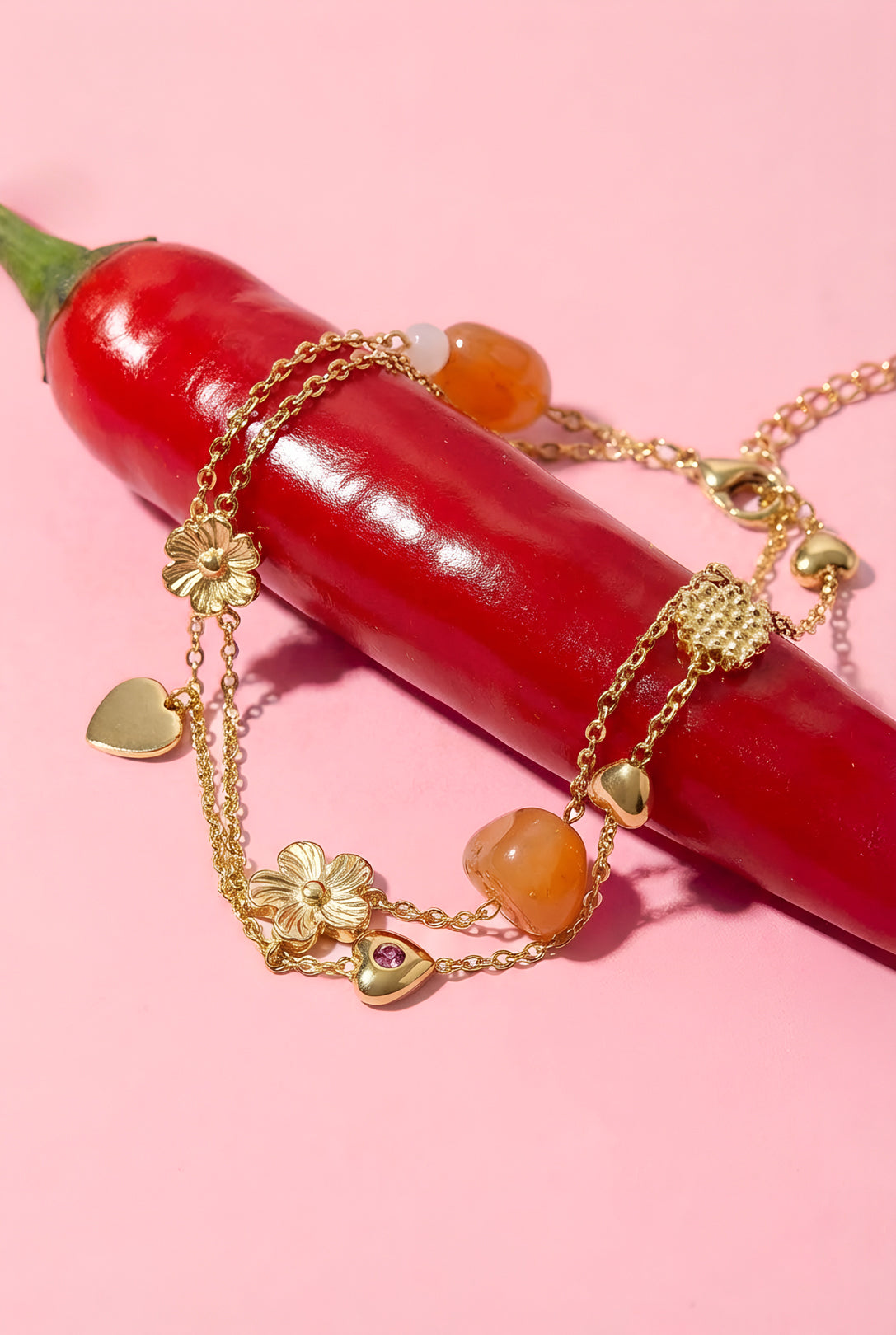 Braccialetto con ciondoli a forma di perline arancioni, fiori e cuori