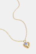Collana con ciondolo a forma di cuore e perlina su un anello