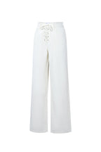 Jeans in denim con lacci