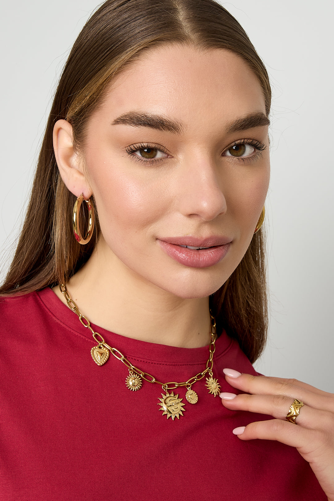 Collana con ciondoli a forma di sole e cuore